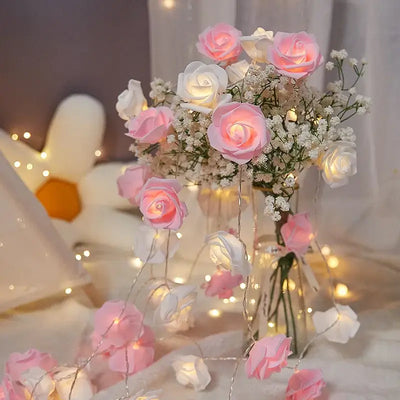 Pink, red, and white rose string lights beautifully arranged in a vase with fairy lights, perfect for decor and celebrations.